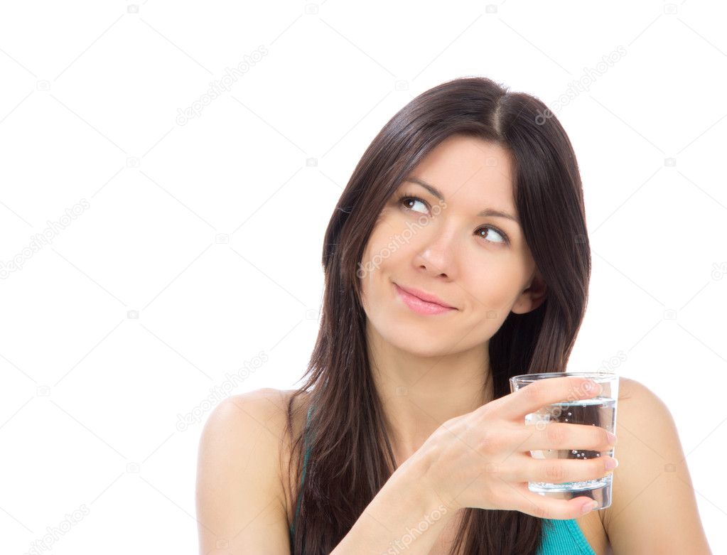 Woman drinking water from clear glass
