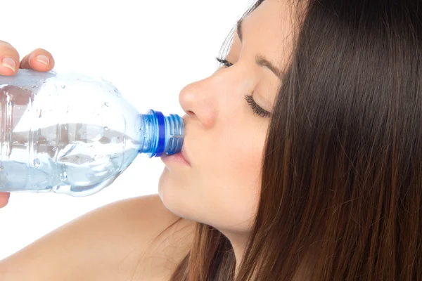 Žena pije waterfrom sklo — Stock fotografie