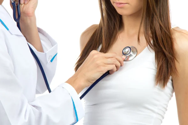 Doctor woman auscultating young patient — Stock Photo, Image