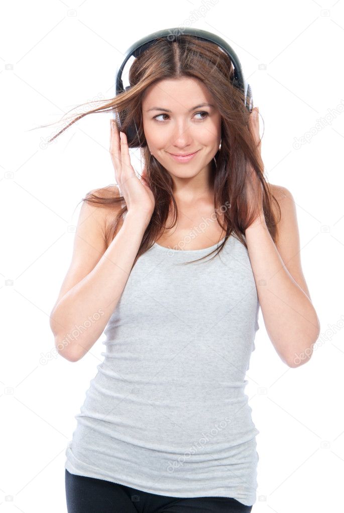 Woman listening and enjoying music in headphones earphones