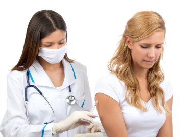 Doctor making insulin or flu vaccination shot clipart