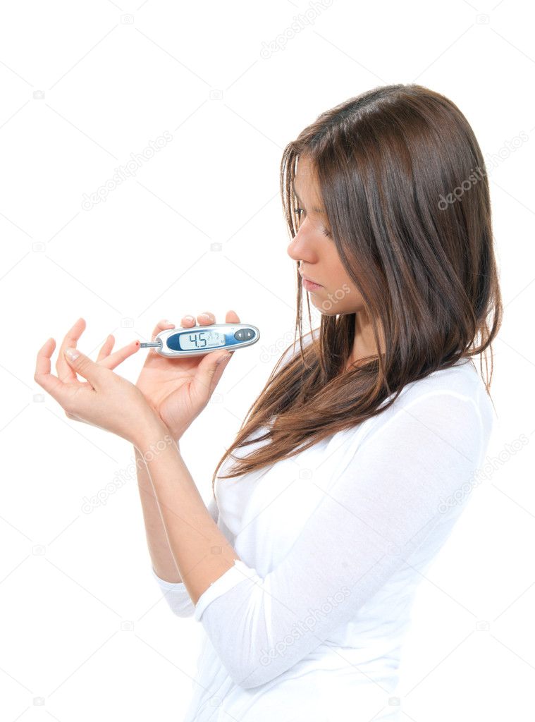 Woman measuring glucose level blood test