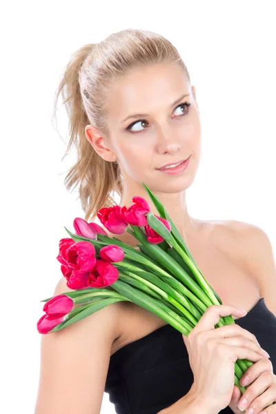 Jovem com buquê de flores de tulipas vermelhas — Fotografia de Stock
