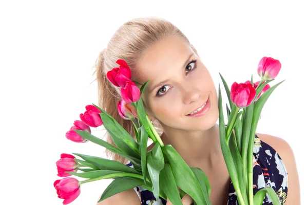 Young woman with bouquet of red tulips flowers — Stock Photo, Image