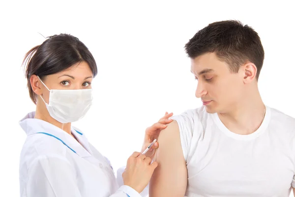Woman give flu vaccination or insulin injection shot Stock Photo