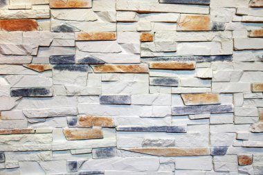 Interior wall decorated with stone as abstract background. clipart