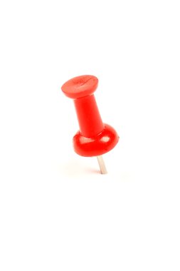 Macro of red drawing pin isolated on white background.