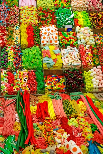 stock image Huge amount of colored sweet things at Barcelona market as backg