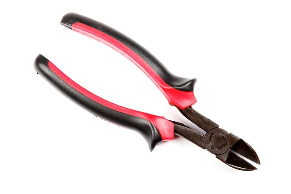 Red with black cutting pliers isolated on white background. — Stock Photo, Image