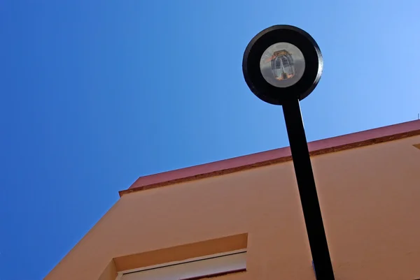 Abstract forms. Street light and building corner. Lloret de Mar, — Stock Photo, Image