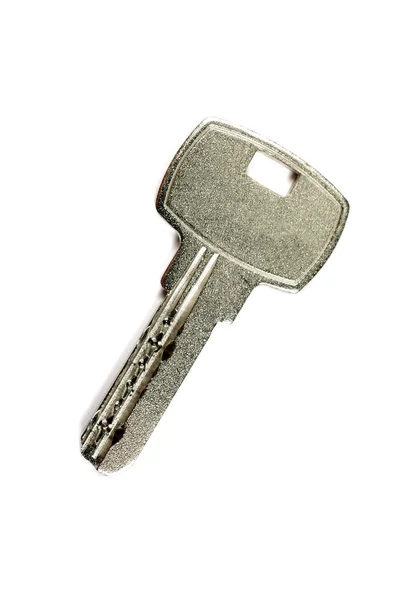 Una chiave moderna isolata su sfondo bianco . — Foto Stock