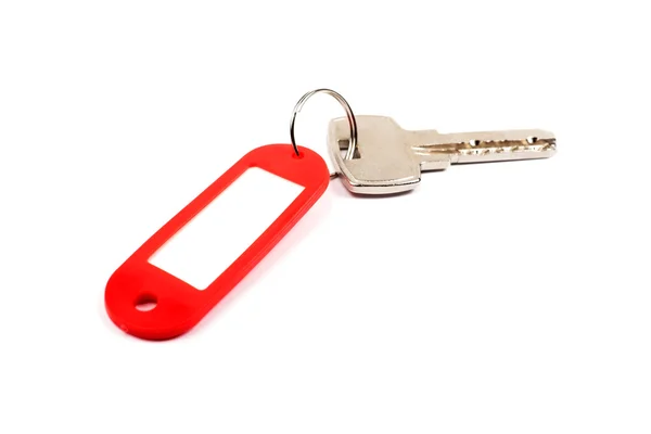 Nyckel och röd fasad med Tom för din design utrymme isoleras på — Stockfoto