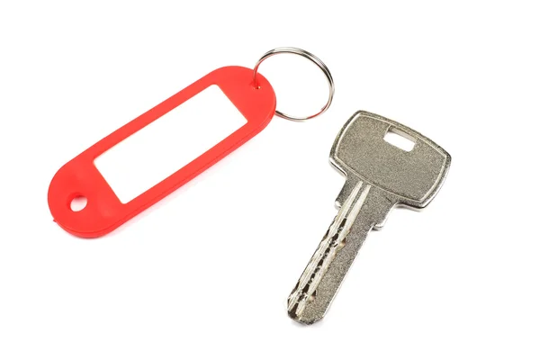 Cheia și buzunarul roșu cu gol pentru spațiul dvs. de design izolat pe — Fotografie, imagine de stoc