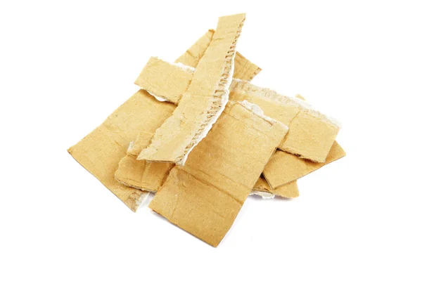 Heap of torned cardboard isolated on the white background. — Stock Photo, Image