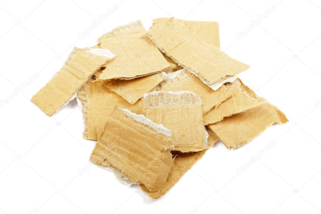 Heap of torned cardboard isolated on the white background.