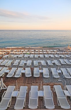 Lot of deck-chairs at the beach of city of Nice, France, Cote d'