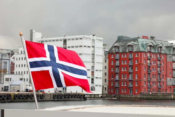 stock image Harbor of the city of Bergen. Focus on norwegian flag. Summer sc