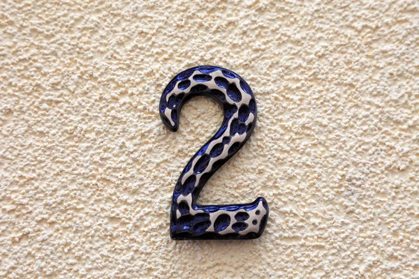 Number two made of metall on textured surface. — Stock Photo, Image