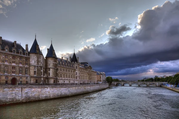 stock image Conciergerie before rain in Paris, dramatic cloudscape.