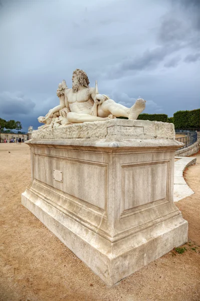 stock image Sculpture in Tuileries gardens and dramatic sky in background, P
