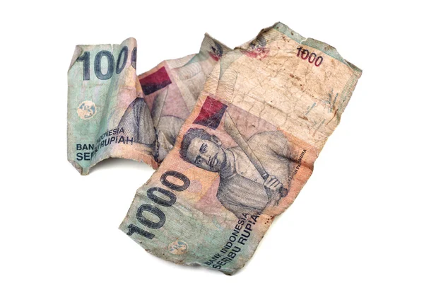 Konceptuální fotografie starých špinavý zmačkaný indonéské rupie, ilustr — Stock fotografie