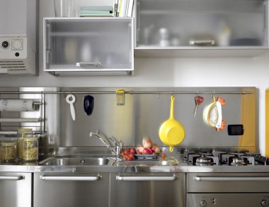 Detail of modern kitchen with steel appliances clipart