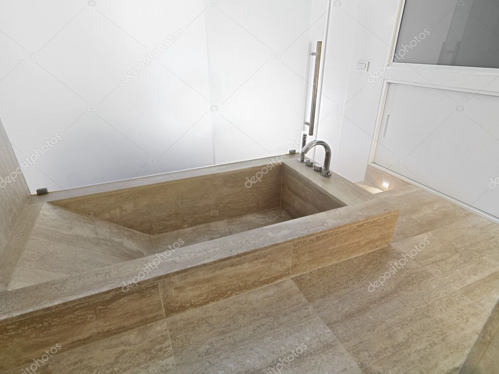 Marble bathtub in modern bathroom
