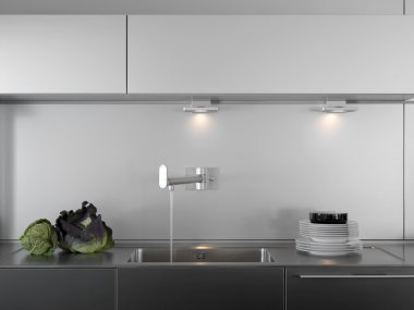 Detail of sink in a modern kitchen clipart