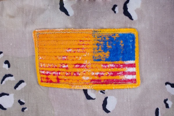 stock image Us army flag on desert camouflage jacket