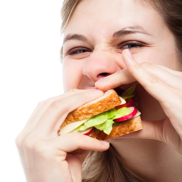 Hlad žena jíst sendvič — Stock fotografie