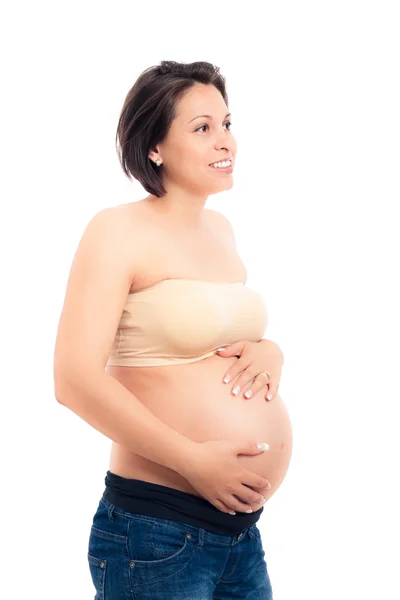 Счастливая беременная женщина, держащая свой живот — стоковое фото