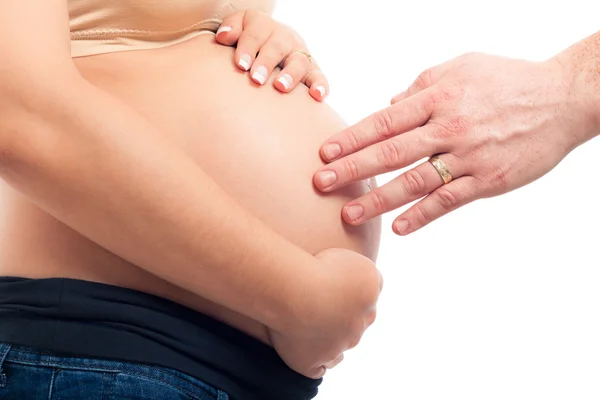 Zwangere vrouw en mannenhand touch — Stockfoto
