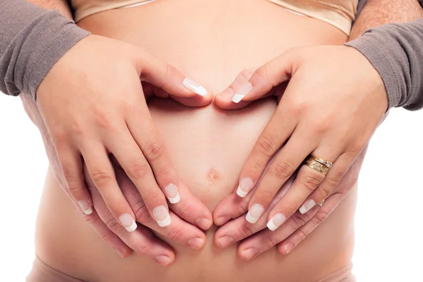 Rukama dotýkat těhotné břicho — Stock fotografie