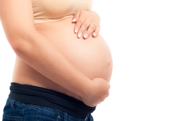 Těhotná žena dotýká břicho — Stock fotografie