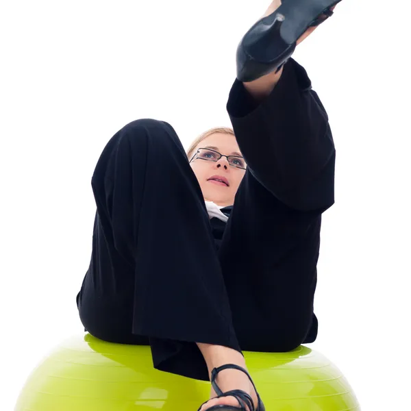 Businesswoman falling down from exercise ball — Stock Photo, Image