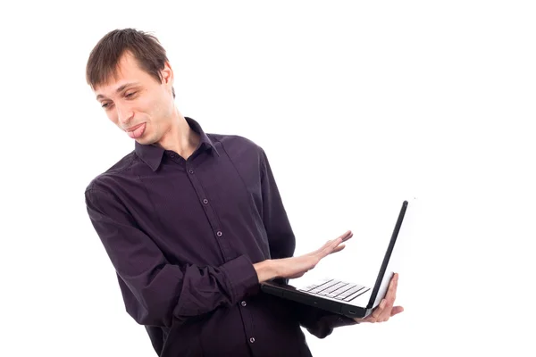 Funny weirdo disgusted man holding laptop Stock Image