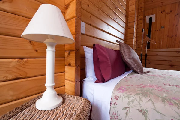 Wooden lodge bedroom interior detail — Stock Photo, Image
