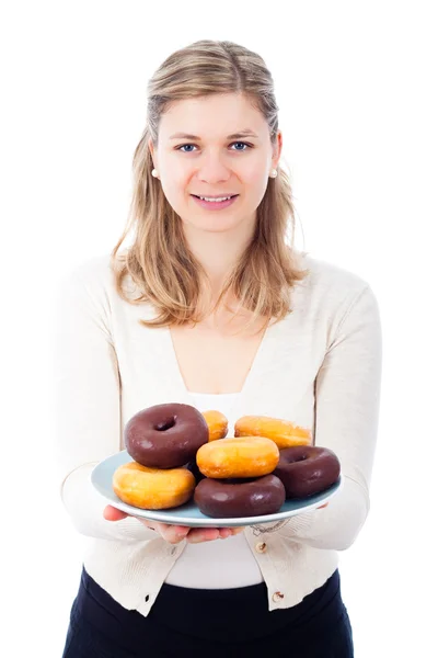 Happy woman holding plate with delicious sweet donuts — Stock Photo, Image