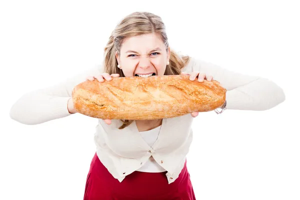 Голодная женщина с хлебом — стоковое фото