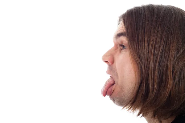 혀를 튀어나와 남자 얼굴의 프로필 — 스톡 사진