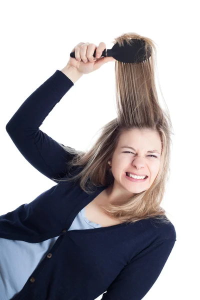 Mulher cabeleireiro doloroso usando escova de cabelo — Fotografia de Stock