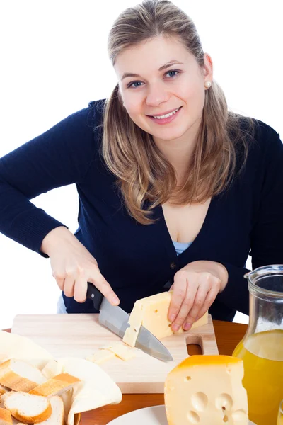 Happy woman cutting cheese — Stock Photo, Image