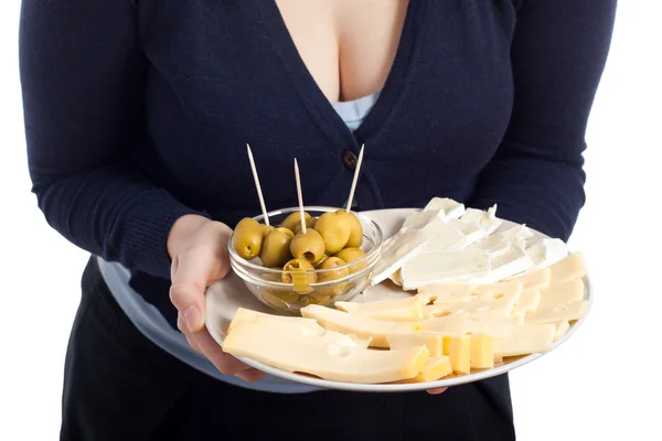 Woman holding plate with fresh olives and cheese — Stock Photo, Image