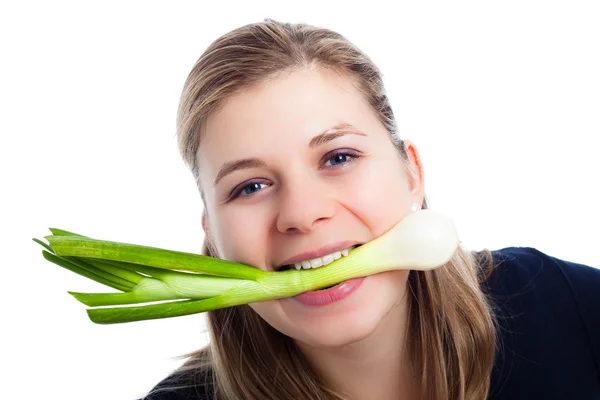 Woman enjoying fresh spring onion — Stock Photo, Image