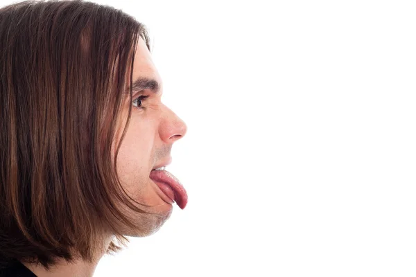 Профиль лица человека, торчащего языком — стоковое фото
