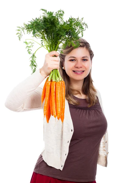 Happy woman holding fresh carrot — Stok fotoğraf