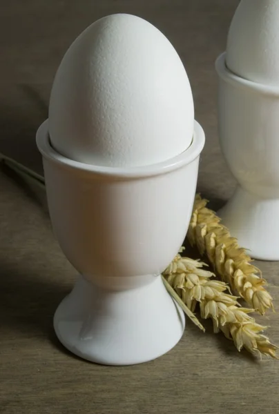 Boiled eggs in egg cups — Stock Photo, Image