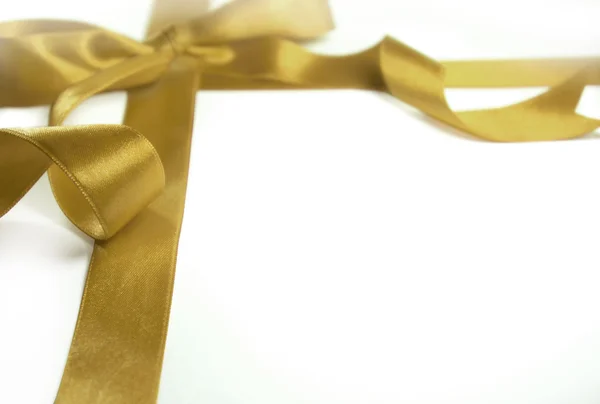 Golden ribbon with the bow — Stock Photo, Image