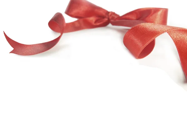 Red ribbon with the bow — Stock Photo, Image