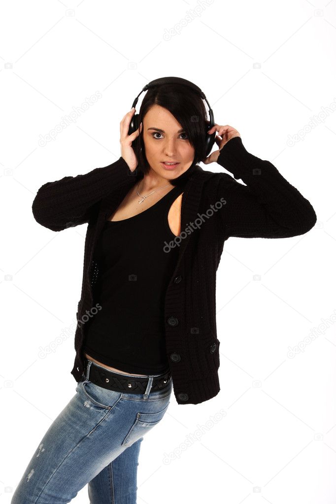 Young woman listen to music through headphones